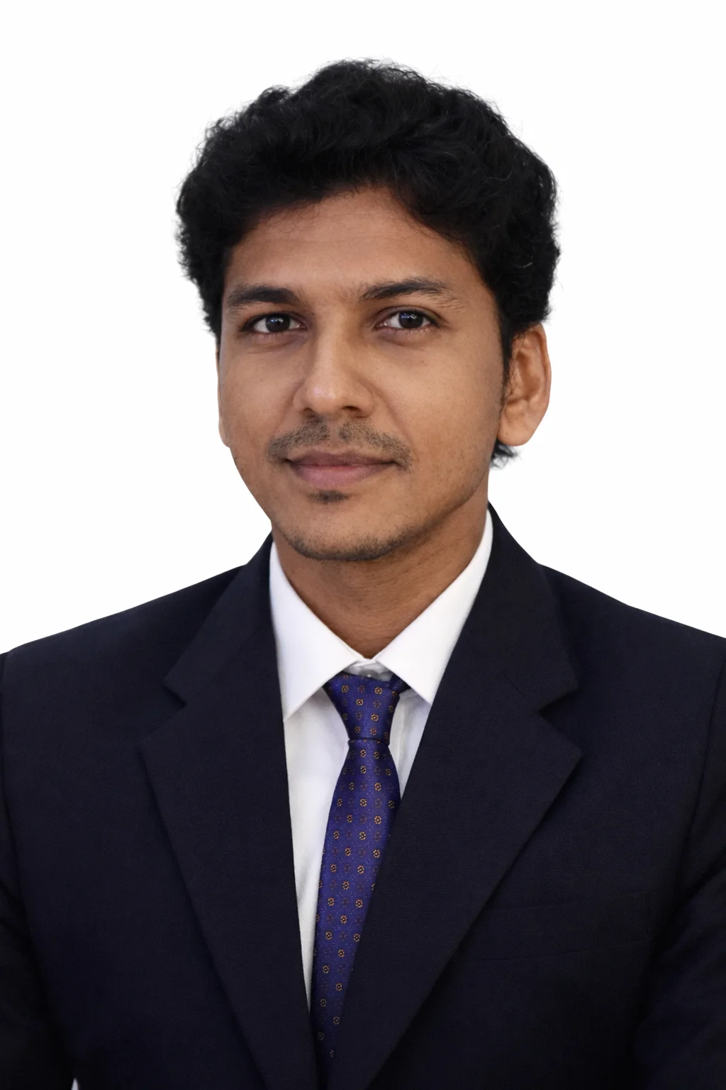 : Dr. Rojan Ravi, ENT Specialist in formal attire