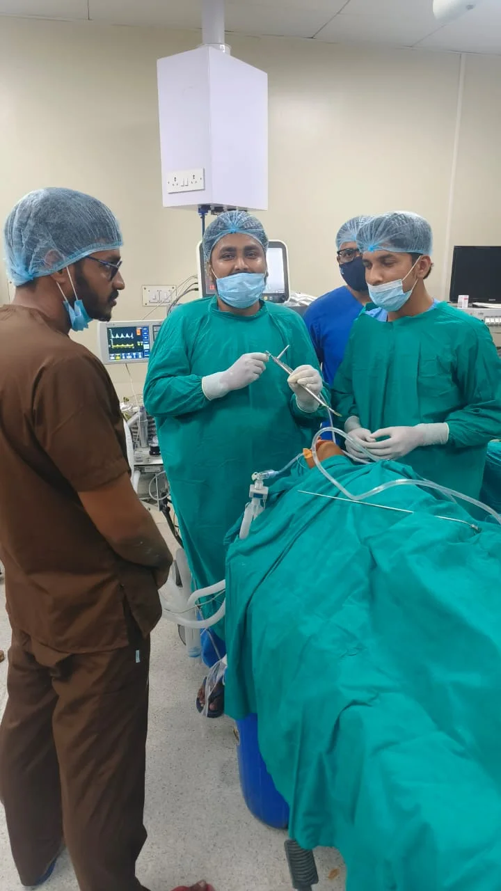 Dr. Rojan Ravi and medical team during an ENT surgical procedure
